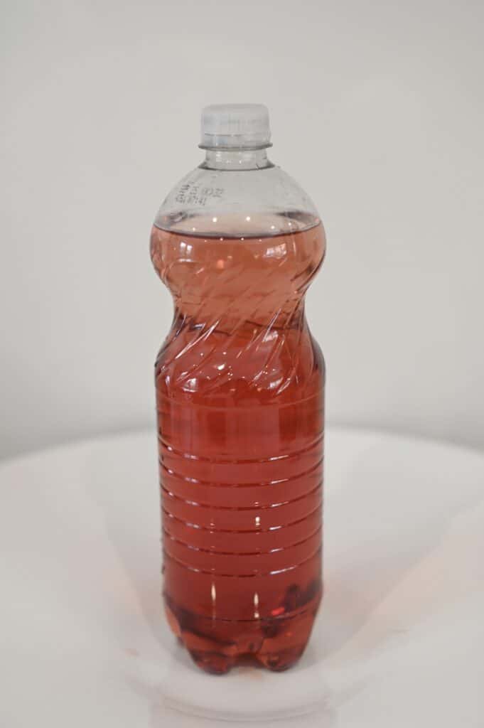 Plastic bottle with a lid filled with water for an air pressure science experiment